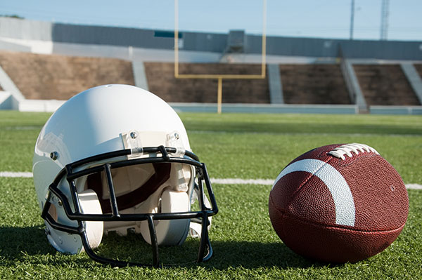 First plastic football store helmet